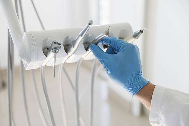 Professional Tooth Extraction technician working in Grand Haven, MI